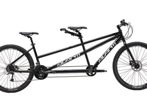 a bicycle leaning against a wall