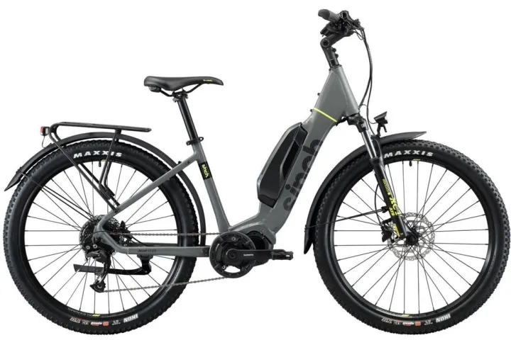 a bicycle is parked next to a brick wall