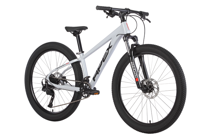 White mountain bike with thick tires and black handlebars.