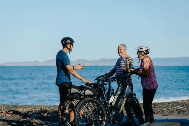 Napier City Bike Hire riders on the ocean pathway at Napier, New Zealand