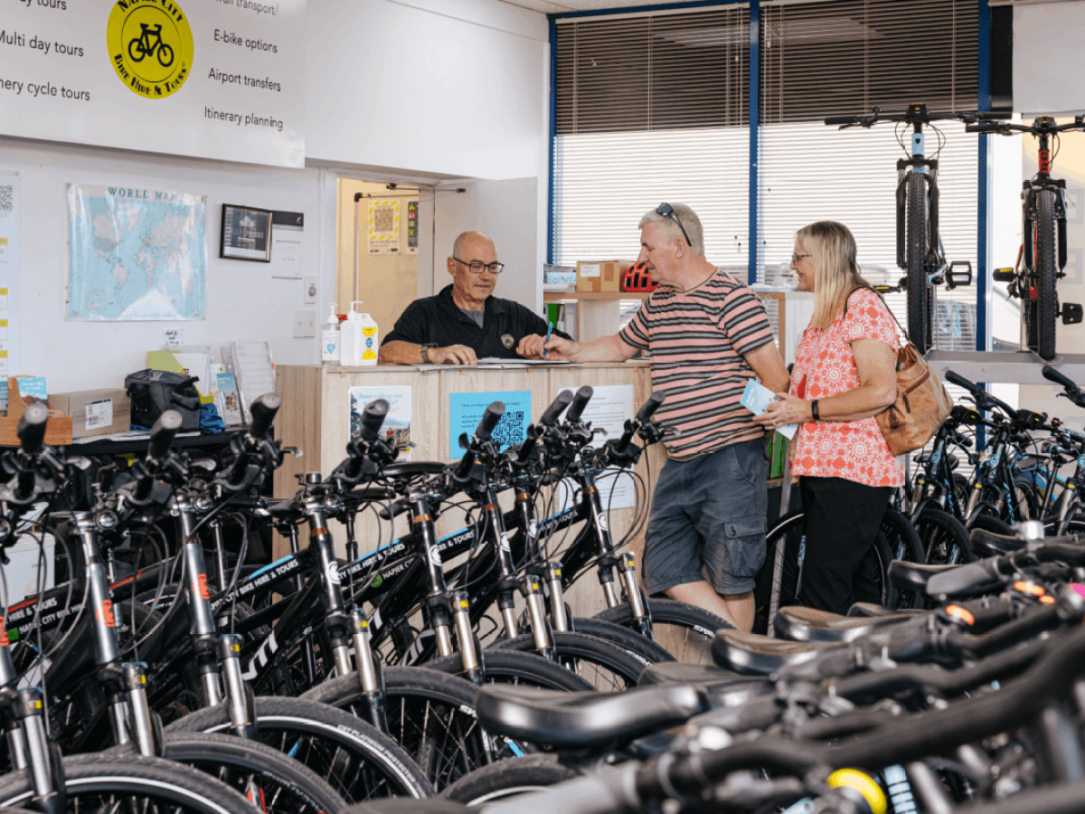 Hire customers discuss their needs at Napier City Bike Hire & Tours in Hawke's Bay