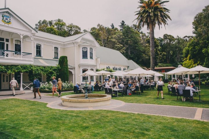 Guests dining on the lawn Mission Estate Winery, Hawke's Bay - a regular dining spot with Napier City Bike Hire & Tours