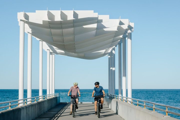Cyclists from Napier City Bike Hire on Napier's waterfront pier